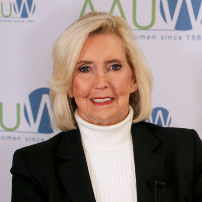 Photo of Lily Ledbetter in front of ɫ logo backdrop
